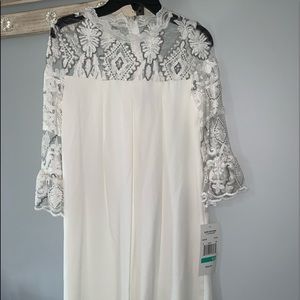 White quarter length sleeve dress
